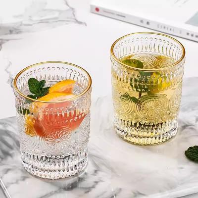 China Sustainable Retro Embossed Lucency Round Sunflower Pattern Daily Home Use Juice  Cups Antique Glass Cups for sale