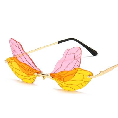 China Eyewear shopping newest sunglasses 2021hot fashion dragonfly wings party rimless sunglasses for ladies for sale