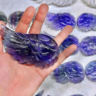 China Custom Healing Crystal Rainbow Fluorite Hand Carved from Europe Natural Stone Flies Crystal Crafts for sale