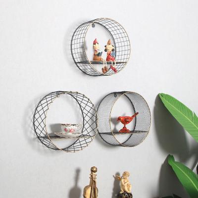 China Nordic Home Wall Mounted Storage Rack + Creative Hollow Wall Shelf Storage Metal Wall Decor for sale