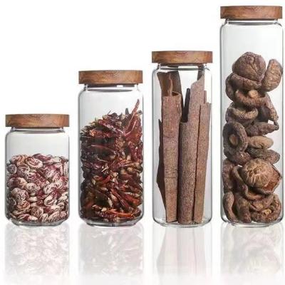 China Viable Home Kitchen Spice Grain Glass Jar Set Multigrain Coffee Flower Tea Storage Container Jars Airtight Seal Glass Jars With Wooden Lid for sale