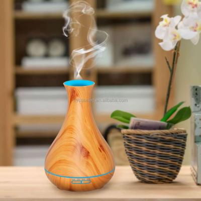 China 500ml Car Aromatherapy Essential Oil Diffuser Wood Grain Remote Control Ultrasonic Air Humidifier with 7 Colors LED Light Humidifier for sale