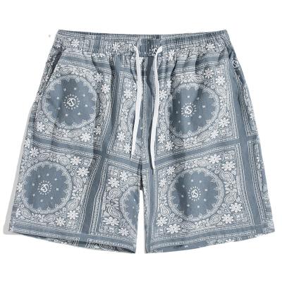 China Anti-wrinkle ready to ship hot sale cotton print pattern beach vacation ethnic shorts for men for sale