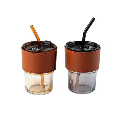 China Sustainable Portable Leather Sleeve Milk Tea Cup Coffee Glass Reusable Beer Mug With Lid And Straw for sale