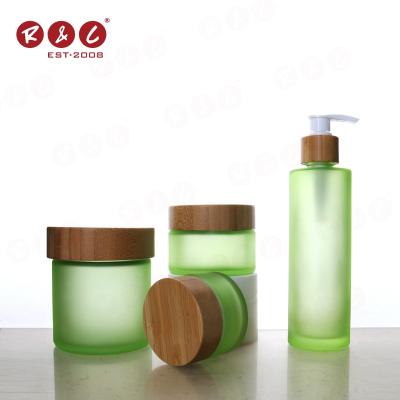 China New 4oz 8oz 12oz Matte Green Bamboo Glass Storage Personal Packaging Skin Care Bamboo Jar Dispensers Cream Jar Luxury Cosmetic Glass Container For Cream for sale