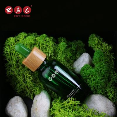 China Essential Oil 2021 2022 Hot Sale 40ml 100ml Luxury Matte Iridescent Thick Bottom Round Glass Dropper Bottle Reasonable Price With Bamboo Lid for sale