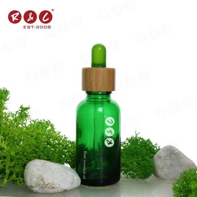 China High Quality Competitive Price Wholesale Empty Green Oil Low Price China Large Capacity Essential Oil Glass Frosted Bottle With Dropper for sale