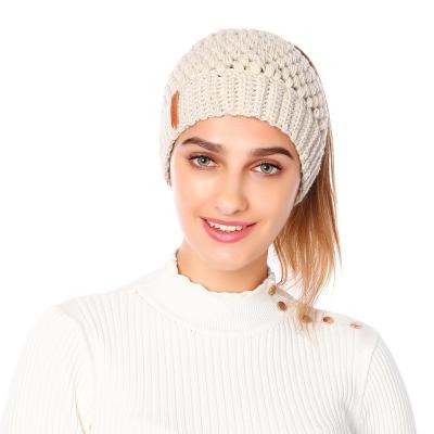 China Winter Knitted Women's New Character Hat Ponytail Hat Beanies Hat With Ponytail Hole for sale