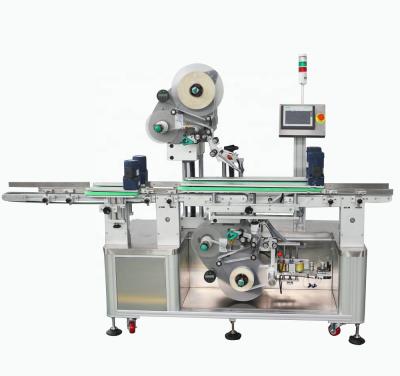 China CLOTHING labeling machine for top and bottom labeling on meat trays for sale