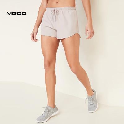 China Anti-Wrinkle MGOO Solid Color Custom Light Weight Quick Dry Sport Shorts Women's Dolphin-Edge Running Abbreviations for sale