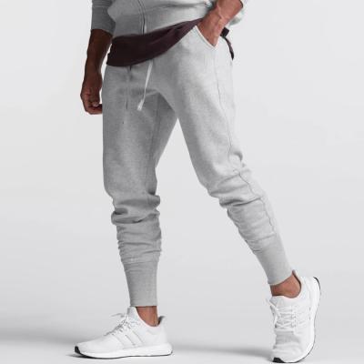 China Anti-Wrinkle Men's Joggers Zipper Pants Casual Fitness Sportswear Jogger Bottoms Black Jogger Track Pants Gyms Skinny Sweatpants Pants for sale