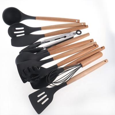 China Sustainable Set of 12 Pieces Silicone Cookware Shovel Spoon Wooden Handle for Cooking Nonstick Cookware for sale