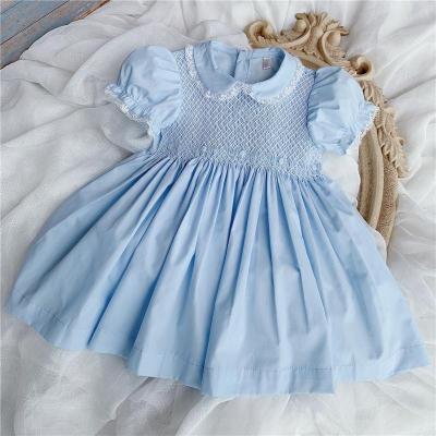 China Boutique Breathable Spanish Smoked Girls Dress Girls Hand Made Smocking Dress Kids Embroidery Smocked Cotton Light Blue Dress for sale