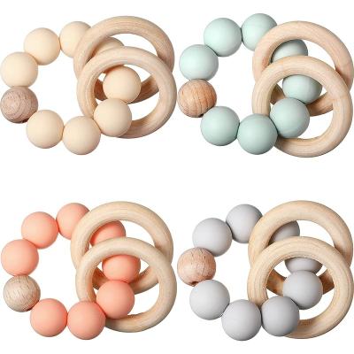 China Relieve Teeth Pain Bpa Free 0-24 Months Newborn Baby Sensory Wooden Ring Teething Chewable Toy for sale