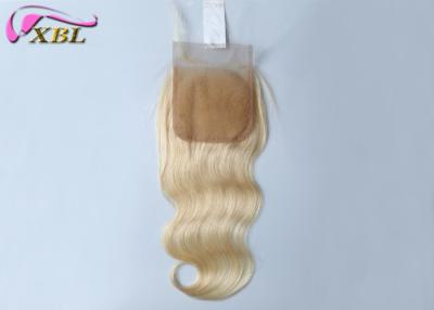 Chine couleur blonde de fermeture de la dentelle 4x4 avec des cheveux de bébé 12 pouces de vague de corps pour la femme de couleur à vendre