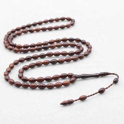 China Islamic Muslim Accessories Dark Brown Tasbih 99 Kuka Rosaries Prayer Beads Religious Hot Sale Bead 5*8MM Kuka Wooden Misbaha Tesbih Factory for sale