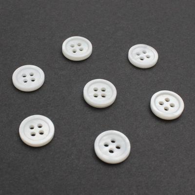 China Viable Factory In Stock Fancy Panties Polyester Sewing Button For Clothes T Shirt Flatback Thin Rim 4 Hole Round White Pearl Shell Button for sale