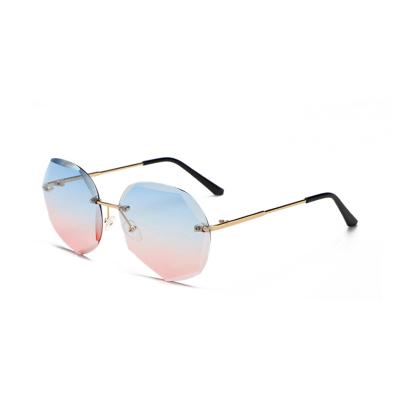 China Fashionable Retro Resin Sunglasses Lenses Wholesale Rimless Rimless Metal Sun Glasses Shades Women for sale