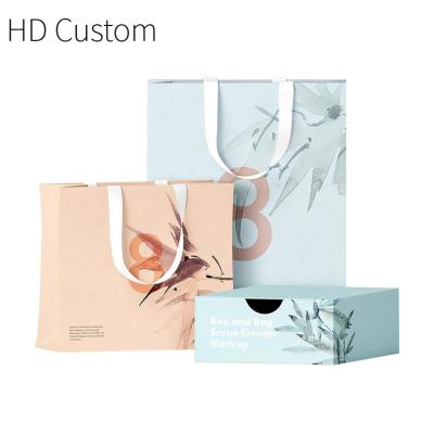 China Custom Made Recyclable Wine Shopping Bag Fashionable Wrappinng Kraft Paper Bag With Handle Lady Apparel Women Luxery Punch Dress for sale