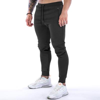 China Breathable Sportswear Gym Fitness Causal Jogger Pants Zipper With Pocket Training Mens Jogger Pants Sweatpants for sale