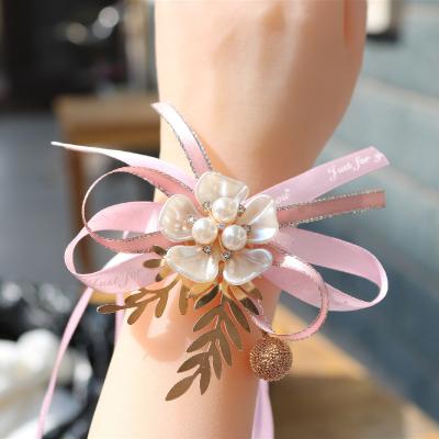 China Wedding Flower Wrist Pearl Bracelet Ribbon Handmade Flower Realistic Korean Bridesmaid New Fashionable Silk Bridal Design for sale