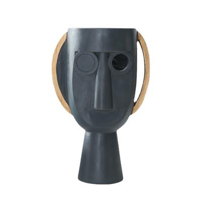 China Wholesale Minimalist Home Decor Black Resin Face Flower Vase for sale