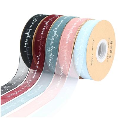 China Wholesale Custom Floral Logo Black Polyester Ribbon Gold Foil Grosgrain Printed Ribbon for sale