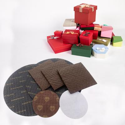 China Recyclable Greaseproof Food Grade Cushion Pads For Chocolate Box Candy Chocolate Paper Cushion Pad for sale