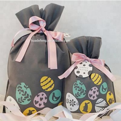 China BIODEGRADABLE Eggs Pattern Gift Pouches Customized Personal Company Logo Non Woven Drawstring Easter Gift Bag for sale