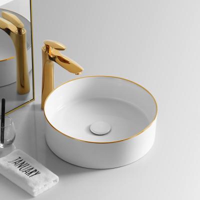 China Luxury Bathroom Sink Lavabo Round Ceramic Gold And White Color Wash Hand Wash Basin Sinks Art Basin for sale