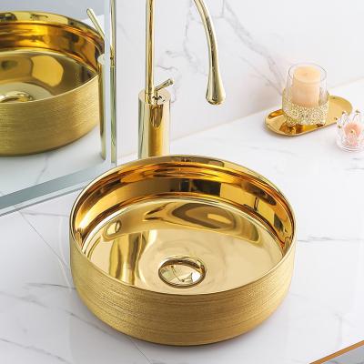 China Luxury Bathroom Sink Brushed Finish Gold Wash Basin Bathroom Sink Ceramic Wash Basin for sale