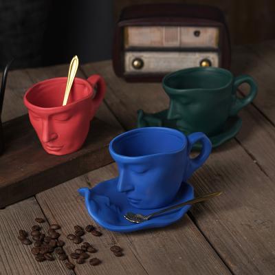 China New Viable Creative Abstract Art Face Kiss Ceramic Cup with Saucer and Spoon Saucer Personalized Coffee or Tea Cup Set Home Tableware for sale