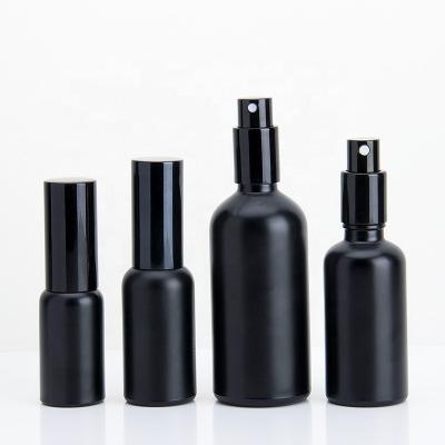 China Essential Oil Bottles 5ml 10ml 15ml 20ml 30ml 50ml 100ml Cosmetic Spray Bottles Black Essential Oil Glass Bottle With Black Pump for sale