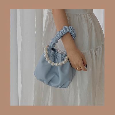 China Lady Niche Design Pearl Ruffles Soft Leather Cloud Bag Korean Fashion Ring Portable Bucket Bag for sale