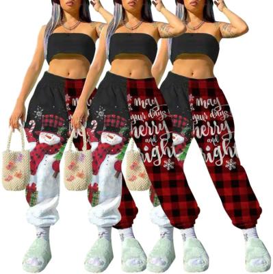 China Hot Selling Anti-Wrinkle Christmas Clothes Snowman Print Plaid Pants Mid-waist Splice Christmas Women's Loose Casual Pants for sale