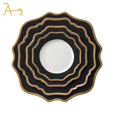 China Sustainable Wholesale sun flower shape gold rim dinner plate sets creative ceramic porcelain plates for wedding hotel and restaurant for sale