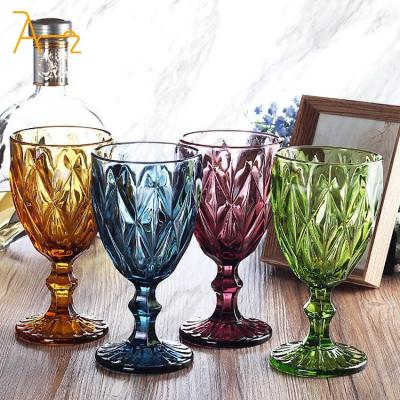 China Colored glass Wholesale wedding wine glasses color embossed pattern transparent drink cup pink retro diamond champagne glass goblets for party for sale