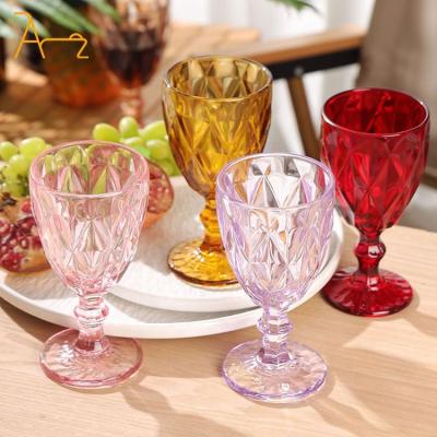 China Sustainable Hot selling wedding use products 2023 new design colored glassware vintage glass goblets unique embossed drinking wine glass for sale