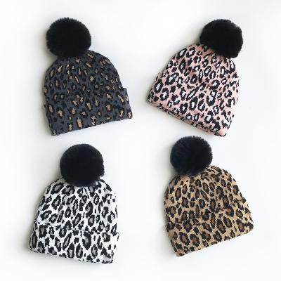 China COMMON Wool Yarn Chunky Toque Knitted Pom Pom Leopard Beanies Hats For Women Fur Beanie Winter Hats Cap With for sale