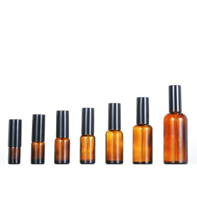 China Selling Amber Glass Essential Oil Personal Care Bottles 100ml Black Fine Spray Bottle Mist Spray 100ml Spray Bottle Glass Bottle for sale