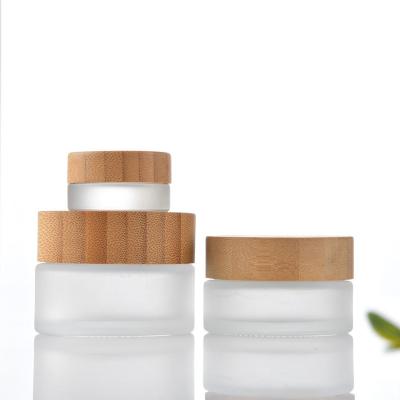 China Personal Care 20ml Cosmetic Glass Jar With Bamboo And Wooden Cover for sale