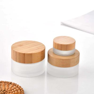 China Personal Care 10ml Cosmetic Cosmetic Cream Jar With Wooden Lid Glass Jar for sale