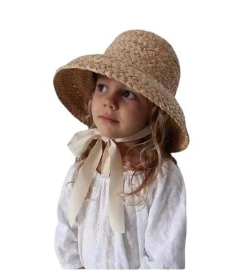 China Factory high quality raffia kids retro beach sun hat summer ribbon baby sun visor simple straw hat for sale