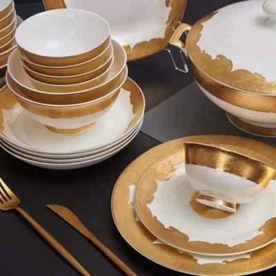 China Sustainable Luxury Liquid Gold Glazed Bone China Ceramic Dinnerware for sale