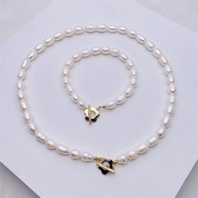 China TRENDY Women's Flower Natural Pearl Aimgal Clavicle Chain Fashion Pearl Bracelet Jewelry Set Long Necklace for sale