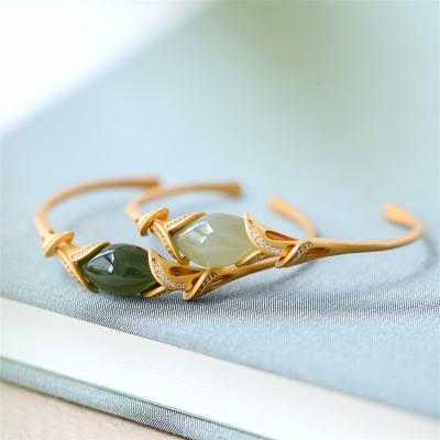 China Aimgal Hetian Jade Calla Lotus Light Style Luxury Gold Plated Inlaid Open Bangle Bracelet For Women for sale