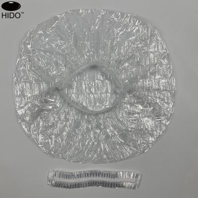 China Sustainable pack of 100 pcs plastic clear waterproof bath cap disposable shower caps for use at home, hotel, spa, and barber shop for sale