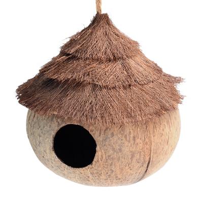 China Natural Coconut Windproof Shell Bird Houses Nest Cage House casitas Pajaros Pet Home Parrot Birds Toy Bird House for sale