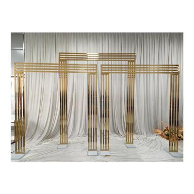 China Durable Wedding Event Party Stage Decoration Supplies Gold Stainless Steel Frame Flower Backdrop Stand Wedding Arch for sale