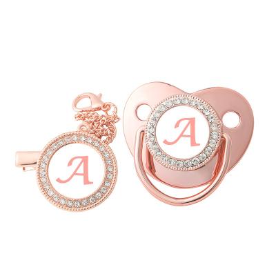 China Silicon 26 Rose Gold Lettering Baby Playmouth Baby Pacifier With Dust Cover for sale